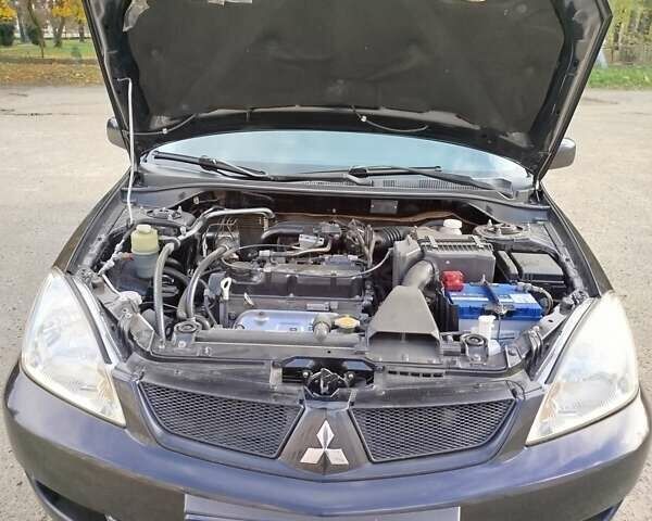 Черный Мицубиси Лансер, объемом двигателя 1.58 л и пробегом 78 тыс. км за 6500 $, фото 10 на Automoto.ua