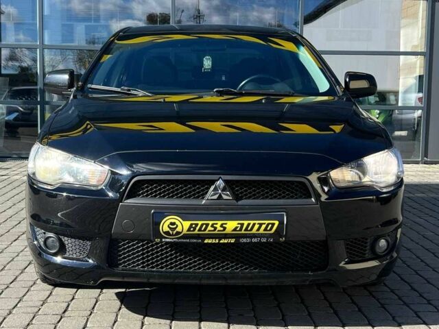 Черный Мицубиси Лансер, объемом двигателя 2 л и пробегом 215 тыс. км за 7000 $, фото 1 на Automoto.ua