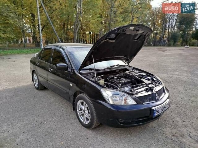 Черный Мицубиси Лансер, объемом двигателя 1.58 л и пробегом 78 тыс. км за 6500 $, фото 4 на Automoto.ua