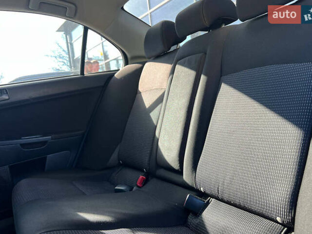 Черный Мицубиси Лансер, объемом двигателя 2 л и пробегом 215 тыс. км за 7000 $, фото 15 на Automoto.ua