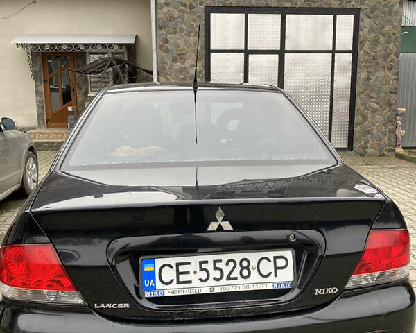 Чорний Міцубісі Lancer, об'ємом двигуна 1.58 л та пробігом 287 тис. км за 4750 $, фото 6 на Automoto.ua