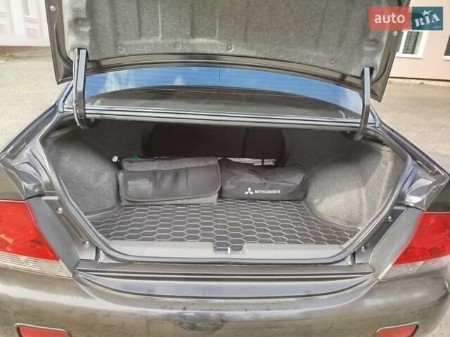 Черный Мицубиси Лансер, объемом двигателя 1.58 л и пробегом 78 тыс. км за 6500 $, фото 15 на Automoto.ua