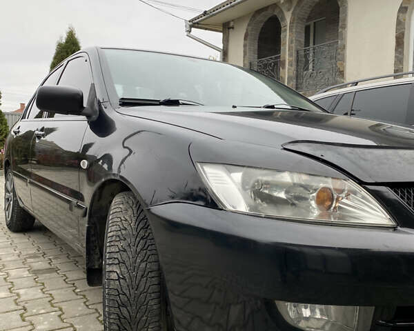 Чорний Міцубісі Lancer, об'ємом двигуна 1.58 л та пробігом 287 тис. км за 4750 $, фото 1 на Automoto.ua