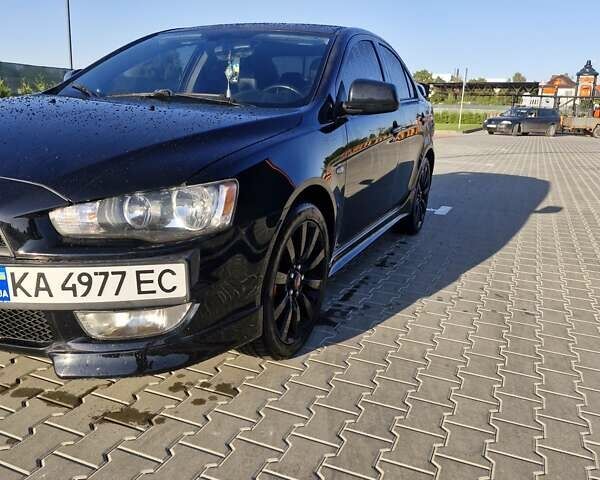 Черный Мицубиси Лансер, объемом двигателя 2 л и пробегом 184 тыс. км за 6999 $, фото 9 на Automoto.ua