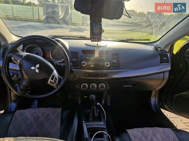 Чорний Міцубісі Lancer, об'ємом двигуна 2 л та пробігом 183 тис. км за 7200 $, фото 16 на Automoto.ua