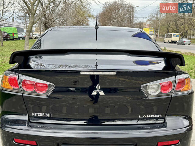 Черный Мицубиси Лансер, объемом двигателя 2 л и пробегом 221 тыс. км за 6750 $, фото 25 на Automoto.ua