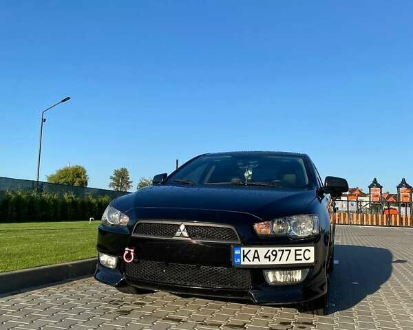 Черный Мицубиси Лансер, объемом двигателя 2 л и пробегом 184 тыс. км за 6999 $, фото 1 на Automoto.ua
