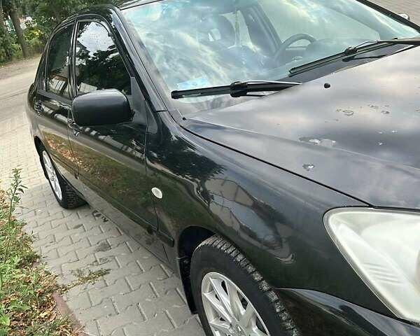 Чорний Міцубісі Lancer, об'ємом двигуна 1.6 л та пробігом 220 тис. км за 3000 $, фото 6 на Automoto.ua