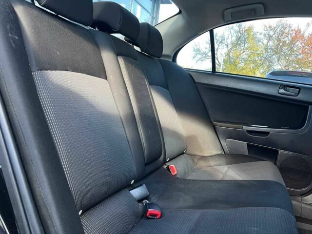 Черный Мицубиси Лансер, объемом двигателя 2 л и пробегом 215 тыс. км за 7000 $, фото 18 на Automoto.ua