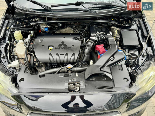 Черный Мицубиси Лансер, объемом двигателя 2 л и пробегом 221 тыс. км за 6750 $, фото 28 на Automoto.ua