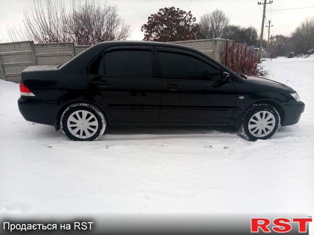 Черный Мицубиси Лансер, объемом двигателя 1.6 л и пробегом 94 тыс. км за 6200 $, фото 2 на Automoto.ua