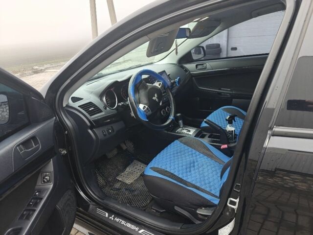 Черный Мицубиси Лансер, объемом двигателя 2 л и пробегом 228 тыс. км за 7000 $, фото 5 на Automoto.ua