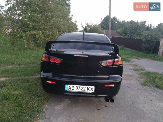 Черный Мицубиси Лансер, объемом двигателя 2 л и пробегом 180 тыс. км за 6999 $, фото 7 на Automoto.ua