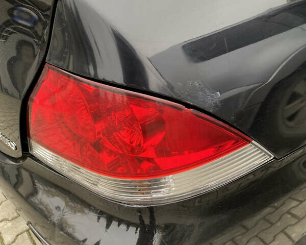 Чорний Міцубісі Lancer, об'ємом двигуна 1.58 л та пробігом 287 тис. км за 4750 $, фото 14 на Automoto.ua