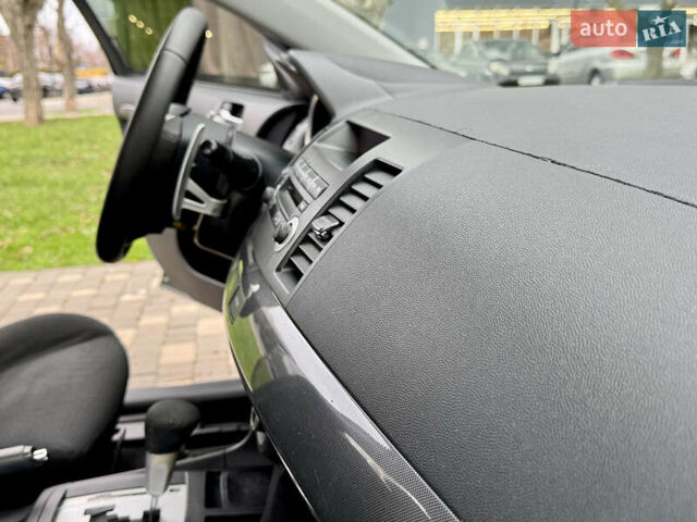 Черный Мицубиси Лансер, объемом двигателя 2 л и пробегом 221 тыс. км за 6750 $, фото 35 на Automoto.ua