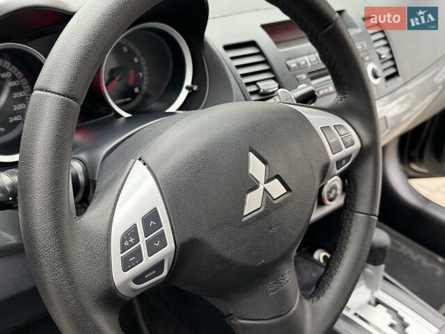 Черный Мицубиси Лансер, объемом двигателя 2 л и пробегом 221 тыс. км за 6750 $, фото 39 на Automoto.ua