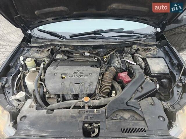 Черный Мицубиси Лансер, объемом двигателя 2 л и пробегом 228 тыс. км за 7000 $, фото 10 на Automoto.ua