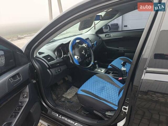 Черный Мицубиси Лансер, объемом двигателя 2 л и пробегом 228 тыс. км за 7000 $, фото 5 на Automoto.ua