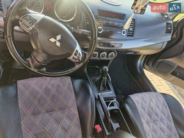 Черный Мицубиси Лансер, объемом двигателя 2 л и пробегом 184 тыс. км за 6999 $, фото 16 на Automoto.ua