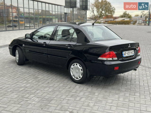 Чорний Міцубісі Lancer, об'ємом двигуна 1.58 л та пробігом 128 тис. км за 5999 $, фото 6 на Automoto.ua