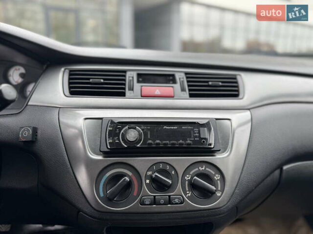 Чорний Міцубісі Lancer, об'ємом двигуна 1.58 л та пробігом 128 тис. км за 5999 $, фото 12 на Automoto.ua