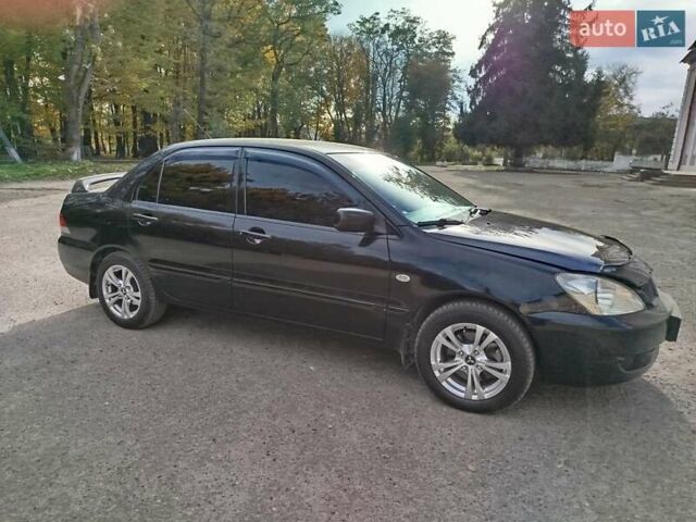 Черный Мицубиси Лансер, объемом двигателя 1.58 л и пробегом 78 тыс. км за 6500 $, фото 9 на Automoto.ua