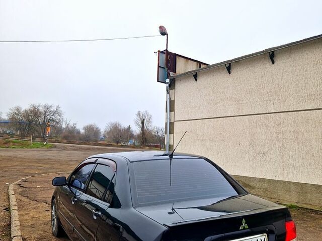 Чорний Міцубісі Lancer, об'ємом двигуна 1.6 л та пробігом 300 тис. км за 3500 $, фото 6 на Automoto.ua