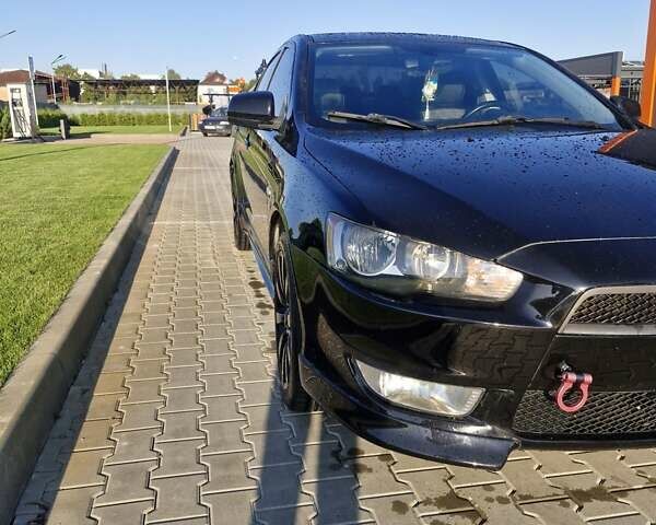 Черный Мицубиси Лансер, объемом двигателя 2 л и пробегом 184 тыс. км за 6999 $, фото 8 на Automoto.ua