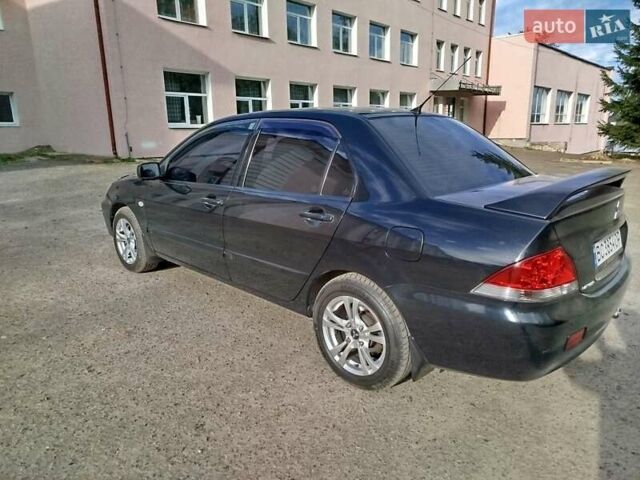 Черный Мицубиси Лансер, объемом двигателя 1.58 л и пробегом 78 тыс. км за 6500 $, фото 3 на Automoto.ua