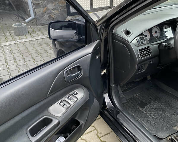 Чорний Міцубісі Lancer, об'ємом двигуна 1.58 л та пробігом 287 тис. км за 4750 $, фото 9 на Automoto.ua
