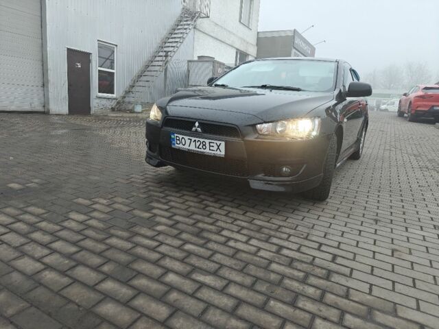 Черный Мицубиси Лансер, объемом двигателя 2 л и пробегом 228 тыс. км за 7000 $, фото 1 на Automoto.ua
