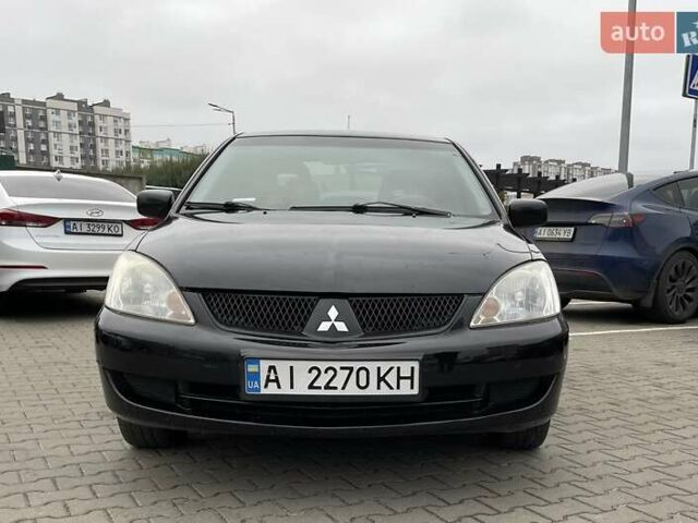 Чорний Міцубісі Lancer, об'ємом двигуна 1.6 л та пробігом 186 тис. км за 5500 $, фото 7 на Automoto.ua