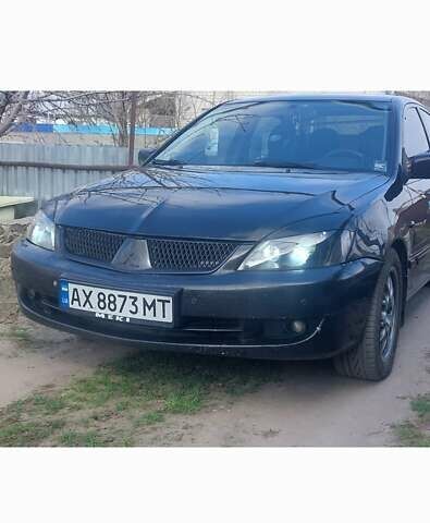 Чорний Міцубісі Lancer, об'ємом двигуна 1.58 л та пробігом 345 тис. км за 4500 $, фото 5 на Automoto.ua