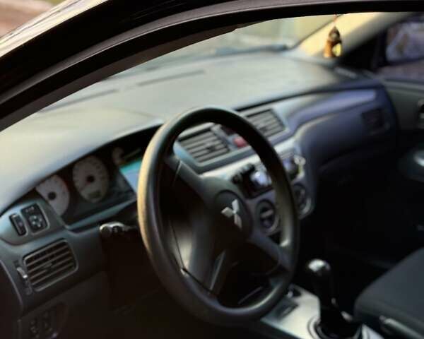 Чорний Міцубісі Lancer, об'ємом двигуна 1.6 л та пробігом 98 тис. км за 5600 $, фото 7 на Automoto.ua