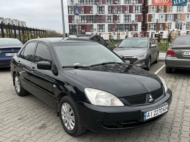 Чорний Міцубісі Lancer, об'ємом двигуна 1.6 л та пробігом 186 тис. км за 5500 $, фото 6 на Automoto.ua