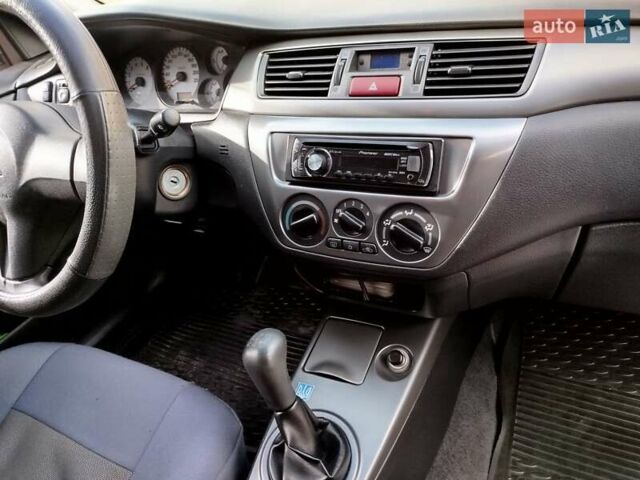 Черный Мицубиси Лансер, объемом двигателя 1.58 л и пробегом 78 тыс. км за 6500 $, фото 24 на Automoto.ua