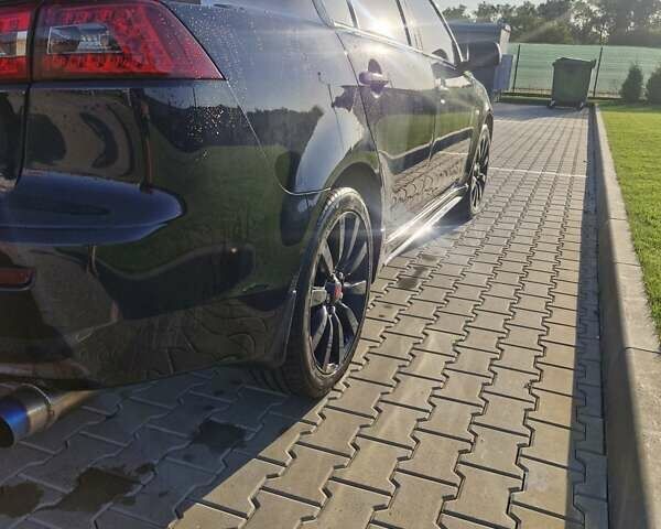 Черный Мицубиси Лансер, объемом двигателя 2 л и пробегом 184 тыс. км за 6999 $, фото 12 на Automoto.ua