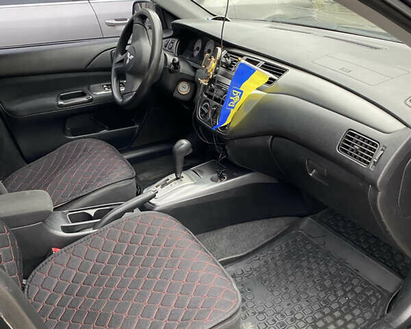Чорний Міцубісі Lancer, об'ємом двигуна 1.58 л та пробігом 287 тис. км за 4750 $, фото 3 на Automoto.ua