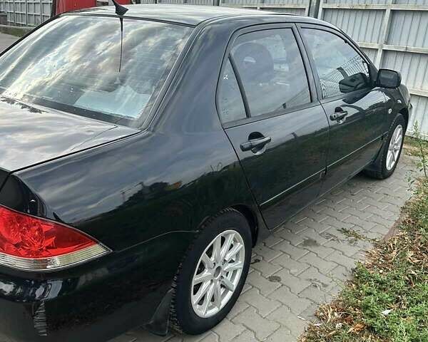 Чорний Міцубісі Lancer, об'ємом двигуна 1.6 л та пробігом 220 тис. км за 3000 $, фото 4 на Automoto.ua