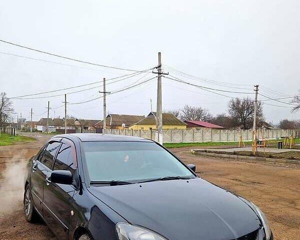 Черный Мицубиси Лансер, объемом двигателя 1.6 л и пробегом 300 тыс. км за 3500 $, фото 2 на Automoto.ua