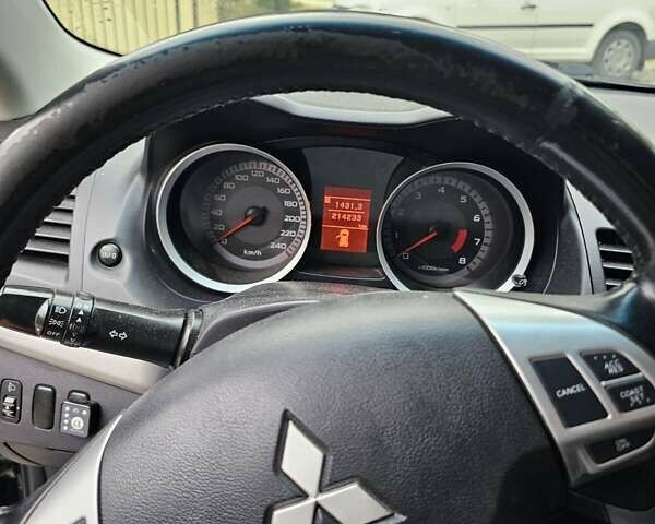 Чорний Міцубісі Lancer, об'ємом двигуна 2 л та пробігом 214 тис. км за 5900 $, фото 3 на Automoto.ua