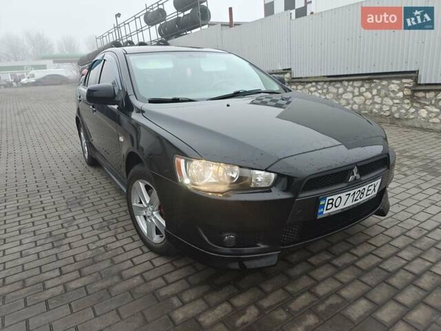 Черный Мицубиси Лансер, объемом двигателя 2 л и пробегом 228 тыс. км за 7000 $, фото 1 на Automoto.ua