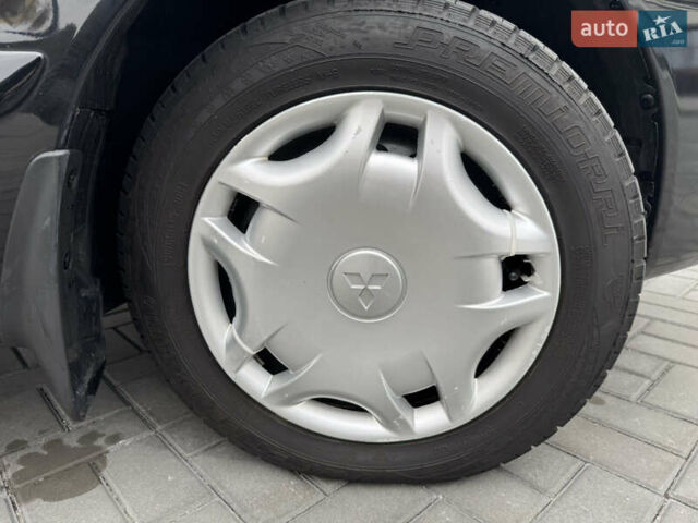 Чорний Міцубісі Lancer, об'ємом двигуна 1.58 л та пробігом 128 тис. км за 5999 $, фото 27 на Automoto.ua