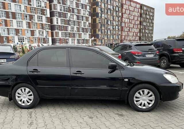 Чорний Міцубісі Lancer, об'ємом двигуна 1.6 л та пробігом 186 тис. км за 5500 $, фото 3 на Automoto.ua
