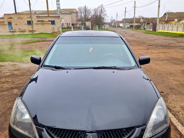 Чорний Міцубісі Lancer, об'ємом двигуна 1.6 л та пробігом 300 тис. км за 3500 $, фото 4 на Automoto.ua