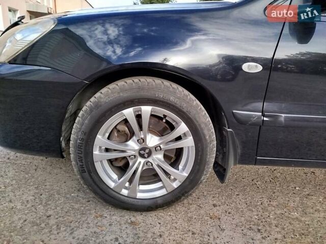 Черный Мицубиси Лансер, объемом двигателя 1.58 л и пробегом 78 тыс. км за 6500 $, фото 5 на Automoto.ua