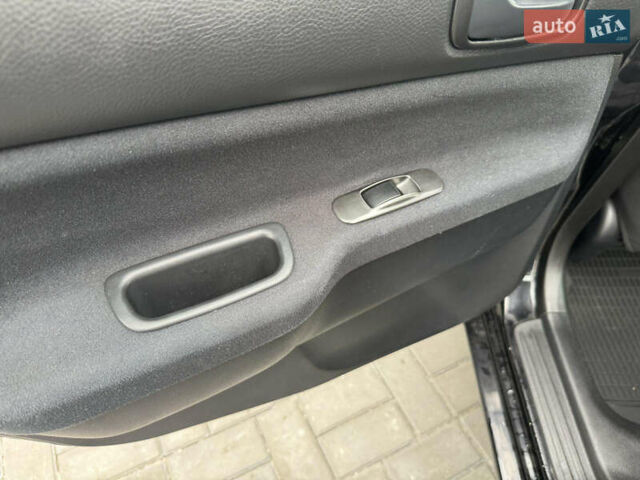 Чорний Міцубісі Lancer, об'ємом двигуна 1.58 л та пробігом 128 тис. км за 5999 $, фото 23 на Automoto.ua