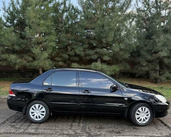 Чорний Міцубісі Lancer, об'ємом двигуна 1.6 л та пробігом 98 тис. км за 5600 $, фото 13 на Automoto.ua