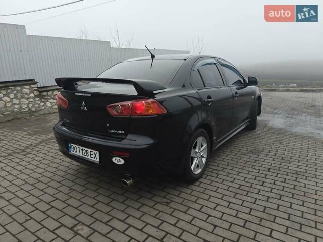 Черный Мицубиси Лансер, объемом двигателя 2 л и пробегом 228 тыс. км за 7000 $, фото 2 на Automoto.ua