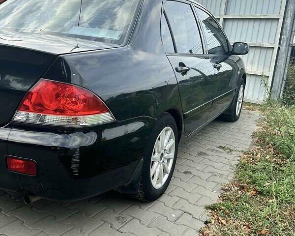 Чорний Міцубісі Lancer, об'ємом двигуна 1.6 л та пробігом 220 тис. км за 3000 $, фото 2 на Automoto.ua